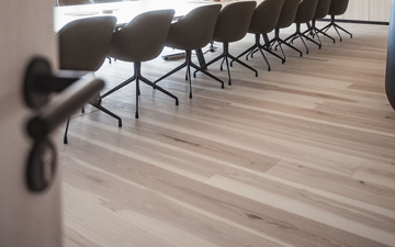 Beautiful ash plank flooring with a brown core