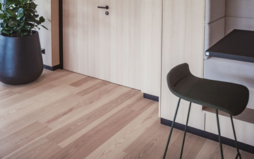 Beautiful ash plank flooring with a brown core